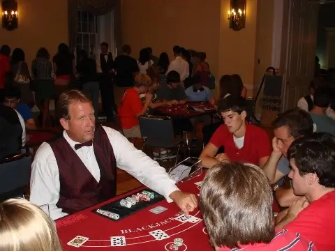 Casino2U Team Member Dealing Cards